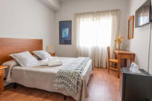 Cama o camas de una habitación en Pensión Casa Castelao 31 O Grove