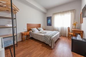 Cama o camas de una habitación en Pensión Casa Castelao 31 O Grove