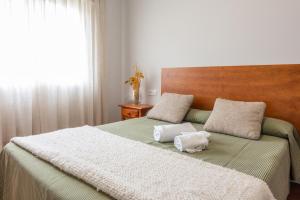 Cama o camas de una habitación en Pensión Casa Castelao 31 O Grove