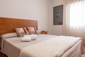 Cama o camas de una habitación en Pensión Casa Castelao 31 O Grove