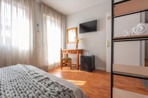 Cama o camas de una habitación en Pensión Casa Castelao 31 O Grove