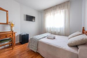 Cama o camas de una habitación en Pensión Casa Castelao 31 O Grove