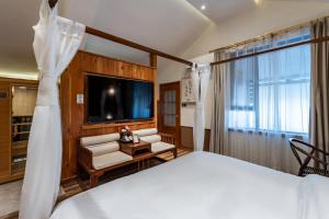 Letto o letti in una camera di Pillow Window & Listen to Rain Hostel Museum Branch Pingjiang Road, Suzhou