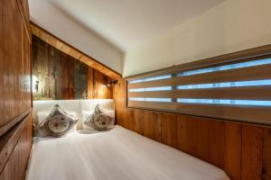 Letto o letti in una camera di Pillow Window & Listen to Rain Hostel Museum Branch Pingjiang Road, Suzhou
