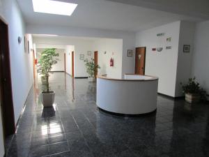 a lobby with a large tub in the middle of a building at ATCamões in Almodôvar
