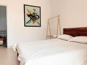 En eller flere senge i et værelse på Phòng ngủ giường đôi ban công Sol homesay