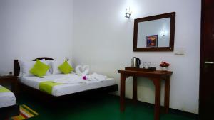 Letto o letti in una camera di Sigiriya Royal Resort