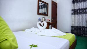 Letto o letti in una camera di Sigiriya Royal Resort