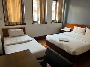 Postel nebo postele na pokoji v ubytování Hotel Earth House
