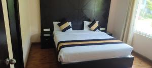Postel nebo postele na pokoji v ubytování Hotel Le Castle