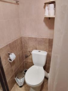 a bathroom with a white toilet in a room at Studio in Sea Breeze Complex Sveti Vlas in Sveti Vlas