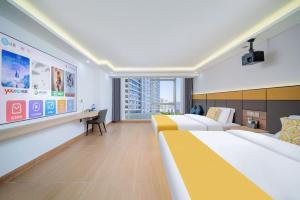 Postel nebo postele na pokoji v ubytování Shengmeiya Apartment Hotel-Line8 Pazhou STN entrance D-Walking distance to Canton Fair