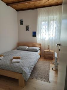 Postel nebo postele na pokoji v ubytování Šumski Miro