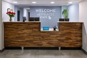 a lobby with a welcome to the beach state sign at Hampton Inn Atlanta/Douglasville in Douglasville