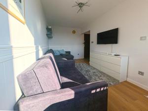 Telewizja i/lub zestaw kina domowego w obiekcie Apartament Parkowy Rabka
