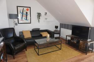 TV a/nebo společenská místnost v ubytování Ferienwohnung in 18107 Elmenhorst kurz vor Warnemünde
