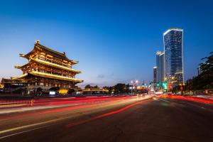 a city street at night with a building and buildings at Grand Hyatt Changsha in Changsha +106 photos