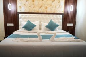 Letto o letti in una camera di Mysore Elite