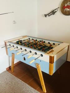 a large foosball table with many weapons on it at Chalupa Brumov in Brumov
