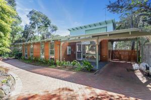 a house with a brick driveway in front of it at Moonah Cottage Rye by Ready Set Stay - BYO LINEN & TOWELS in Rye