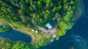 an aerial view of a campsite on an island in the water at Domek nad Kanałem Augustowskim Stanica Wodna PTTK Płaska in Płaska