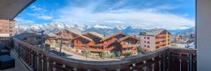 a view from a balcony of a resort with mountains at Pracondu 1 101 - OUTDOOR & FUN apartment 8 pers in Nendaz