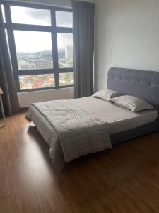 Ένα ή περισσότερα κρεβάτια σε δωμάτιο στο The Nest at Astoria at Kuala Lumpur