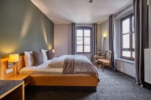 Postel nebo postele na pokoji v ubytování Hotel Roter Hahn