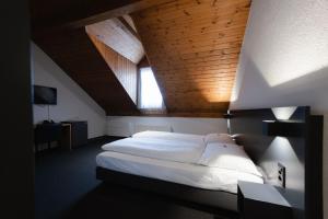Voodi või voodid majutusasutuse HotelChur.ch toas