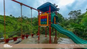 a playground with a slide in a park at Lilly Valley Villa In Lonavala in Lonavala