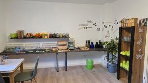 a room with a table and a table and chairs at Pension Hendriks in Cochem +17 photos