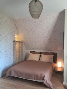 Postel nebo postele na pokoji v ubytování Le Verger (Le Plessis)
