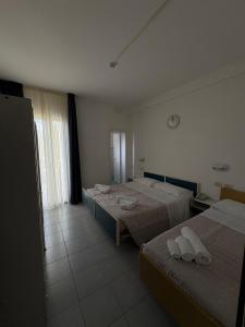Postel nebo postele na pokoji v ubytování Hotel Bianca Orchidea