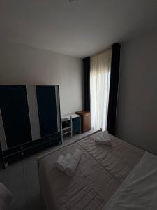 Postel nebo postele na pokoji v ubytování Hotel Bianca Orchidea