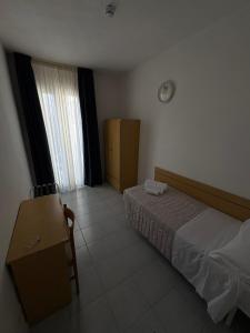 Postel nebo postele na pokoji v ubytování Hotel Bianca Orchidea