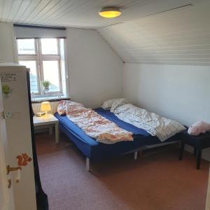 Postel nebo postele na pokoji v ubytování Rundvejen Guest House
