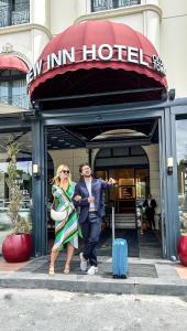 a man and a woman walking out of a hotel at New Inn Hotel Old Town in Istanbul