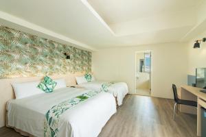 Postel nebo postele na pokoji v ubytování Liga Hotel