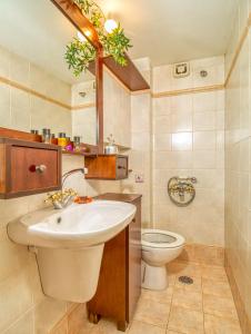 a bathroom with a sink and a toilet at Chanialiving Venetian Luxury House-near Plaza Parking in Chania Town +47 photos