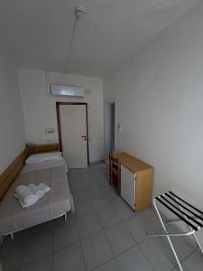 Postel nebo postele na pokoji v ubytování Hotel Bianca Orchidea