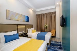 Ένα ή περισσότερα κρεβάτια σε δωμάτιο στο Savoy Hotel Mactan