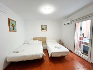 Łóżko lub łóżka w pokoju w obiekcie Residencial Art Brut