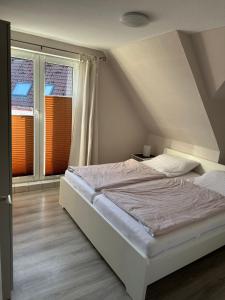 Postel nebo postele na pokoji v ubytování Ferienwohnung-Sued
