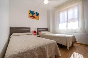 Postel nebo postele na pokoji v ubytování Bernat Vidaber Primera Línea