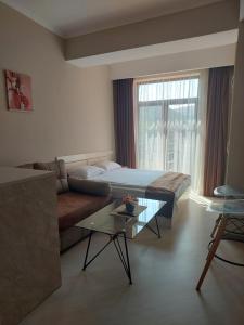 Postel nebo postele na pokoji v ubytování Tsaghkadzor, Alvina Complex Apartment 163 + 10 fotografií