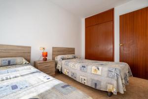 Postel nebo postele na pokoji v ubytování Bernat Vidaber Primera Línea