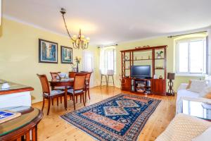 a living room with a table and a couch at Villa Augusta Ferri in Rovinj