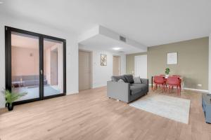 a living room with a couch and a table at Cefalonia Garden with Terrace & Garage by NDP rent in Milan