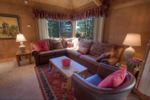 a living room with a couch and chairs and a table at Chimney Rock Condo condo in Stateline