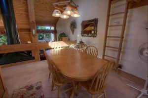 a dining room with a wooden table and chairs at Chimney Rock Condo condo in Stateline